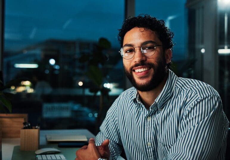 Portrait,,Working,Late,And,Happy,Businessman,In,Office,For,Financial